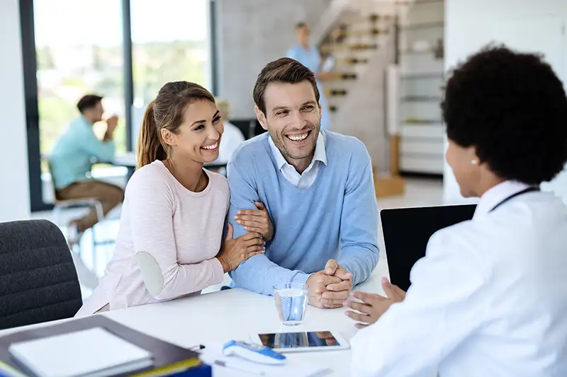 happy-couple-having-consultations-with-a-doctor